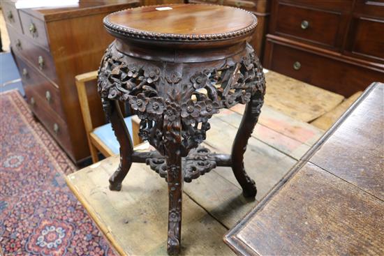 A pair of 19th century Chinese carved hardwood jardiniere stands